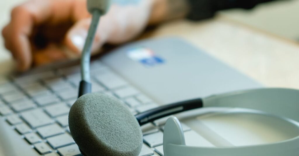 Close-up of a headset on a laptop keyboard, representing remote work and customer support.